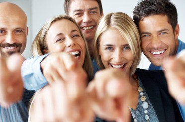 photodune-652445-cheerful-business-people-pointing-at-you-copyspace-xs